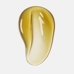 Gold-colored gel or cream on a light gray background