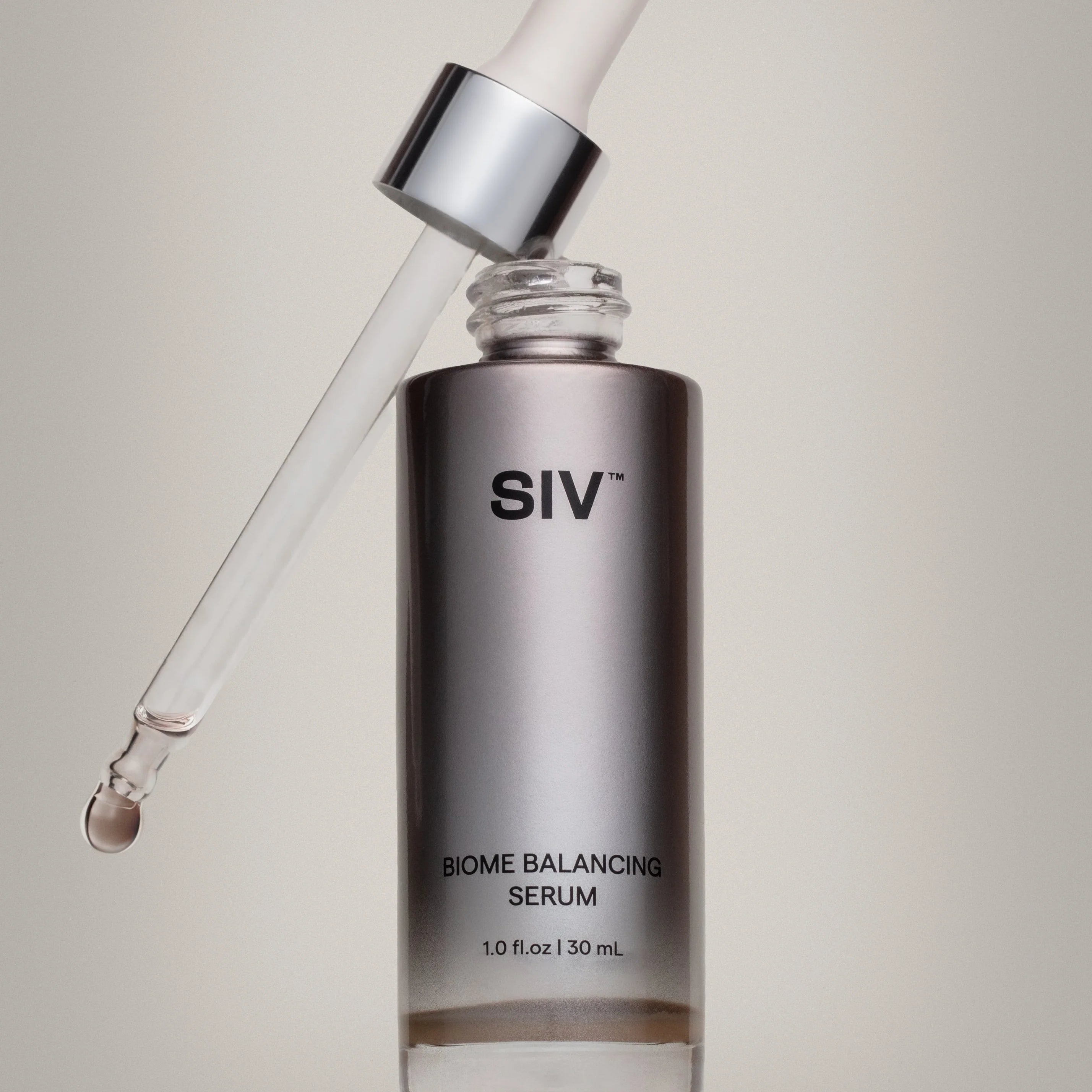SIV Biome Balancing Serum bottle with dropper on a neutral background