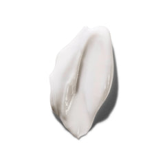 White cream smear on a light gray background